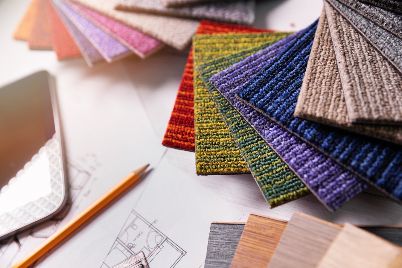 flooring and furniture materials - floor carpet and wooden laminate samples for interior design project